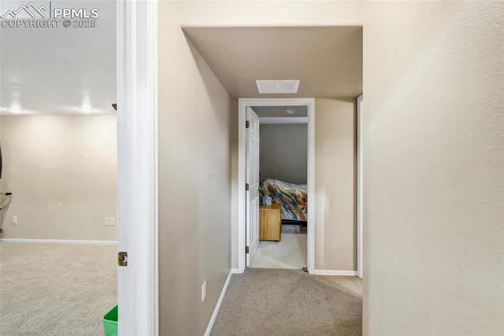 Image 21 of 44: Hallway featuring carpet and baseboards