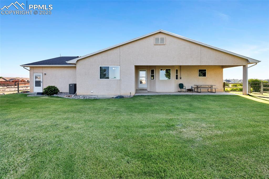 Image 33 of 44: Rear view of property with a patio area and stucco siding
