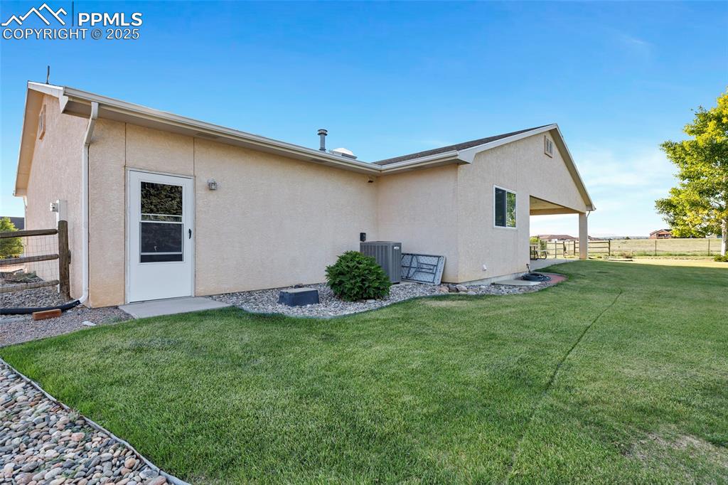Image 34 of 44: Back of house featuring stucco siding