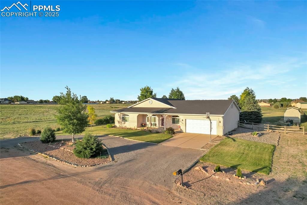 Image 37 of 44: Single story home with driveway, an attached garage, and stucco siding