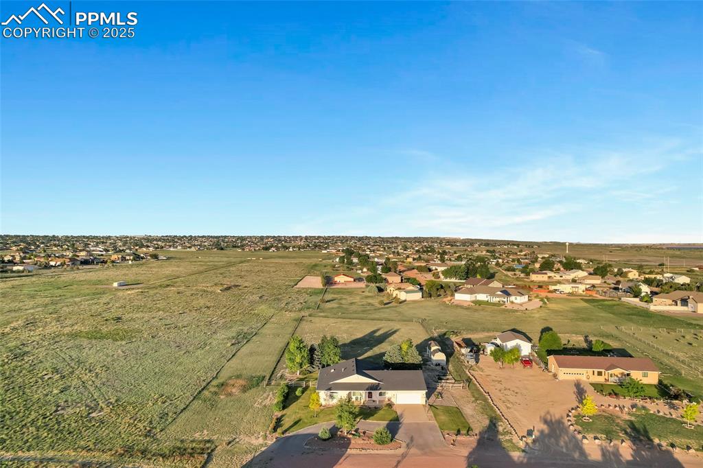 Image 39 of 44: Aerial view of property and surrounding area featuring nearby suburban area