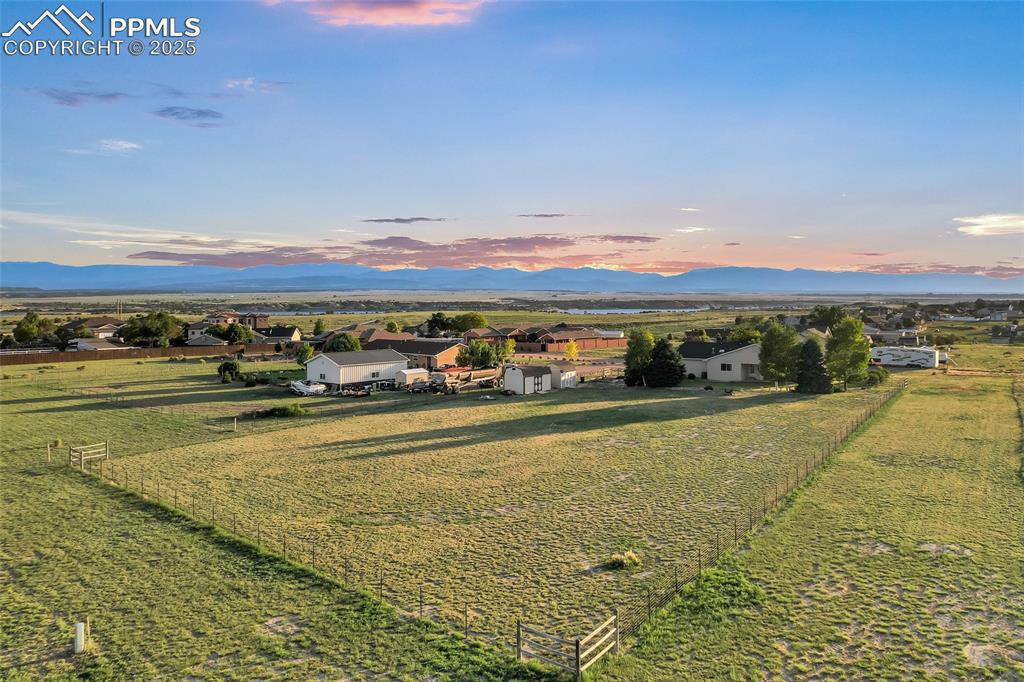 Image 43 of 44: Aerial view at dusk of a mountain view and a view of Lake Pueblo