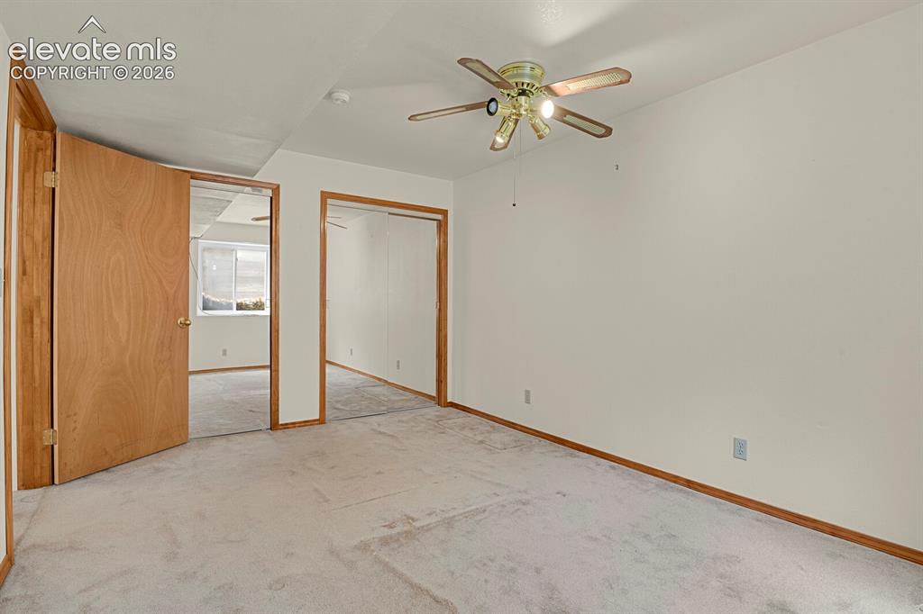 Image 23 of 48: Bedroom featuring light-toned carpeting and white walls