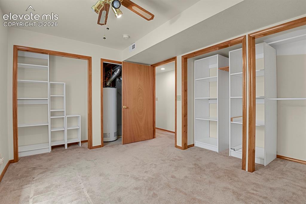 Image 25 of 48: Room featuring light-toned carpeting and neutral wall paint