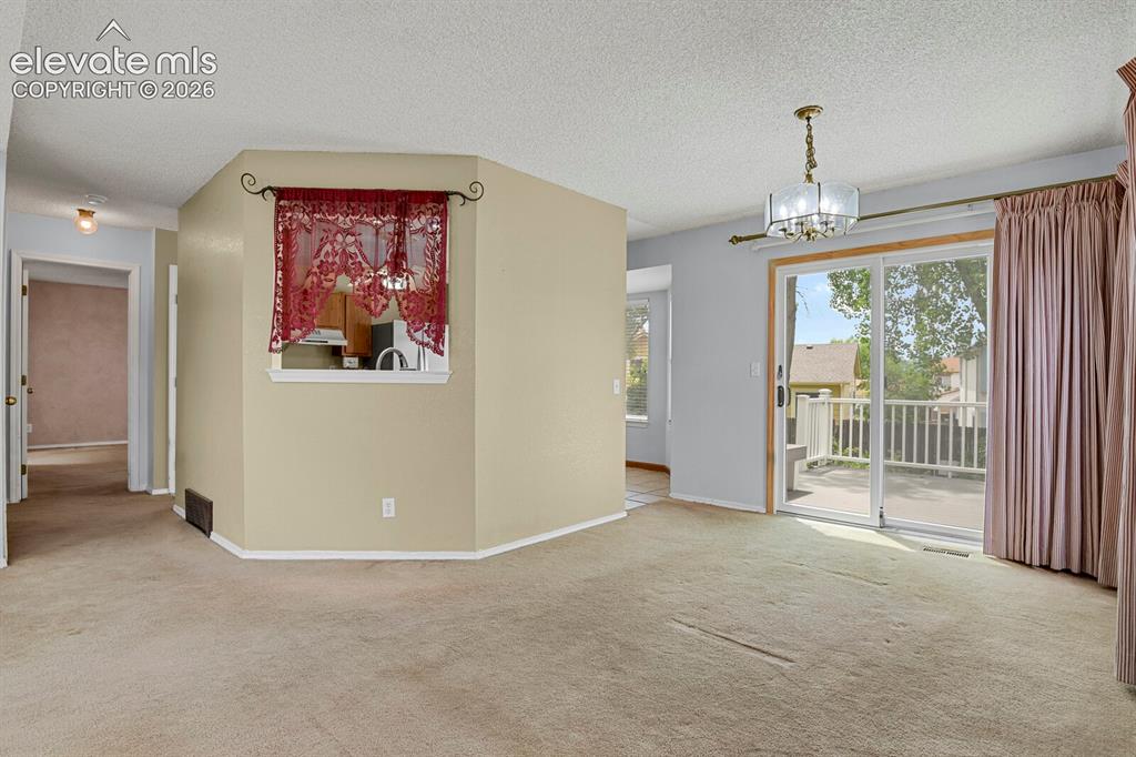 Image 6 of 48: Kitchen and dining view