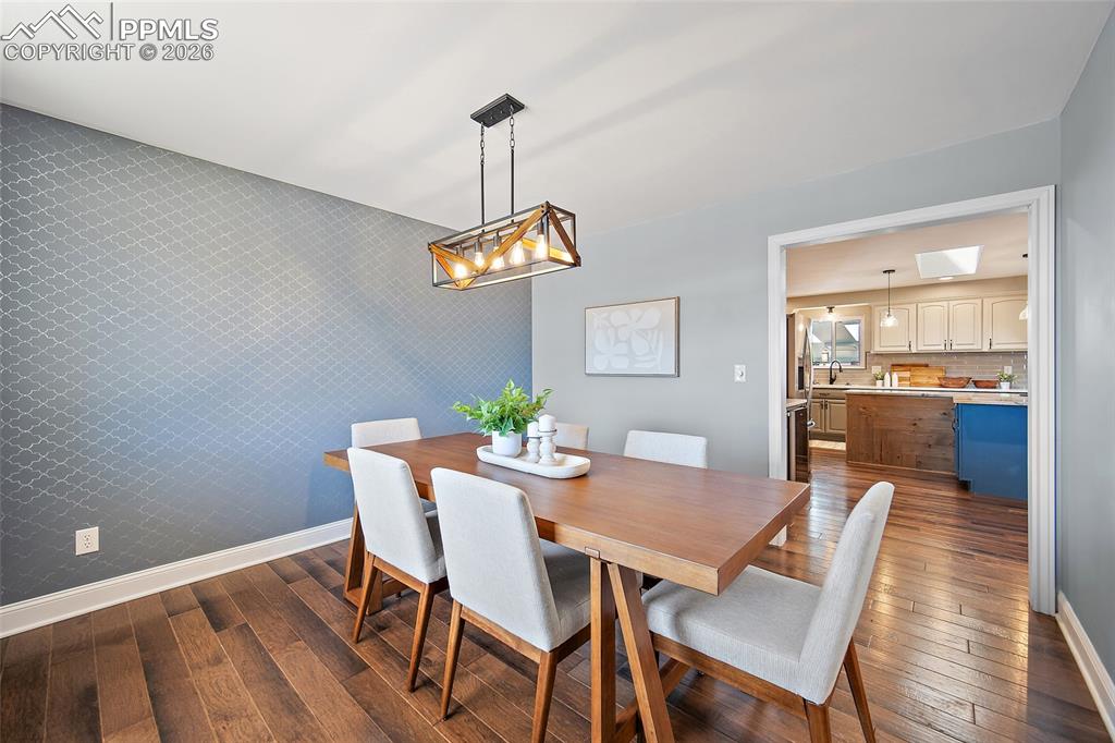 Image 20 of 50: Formal dining room.