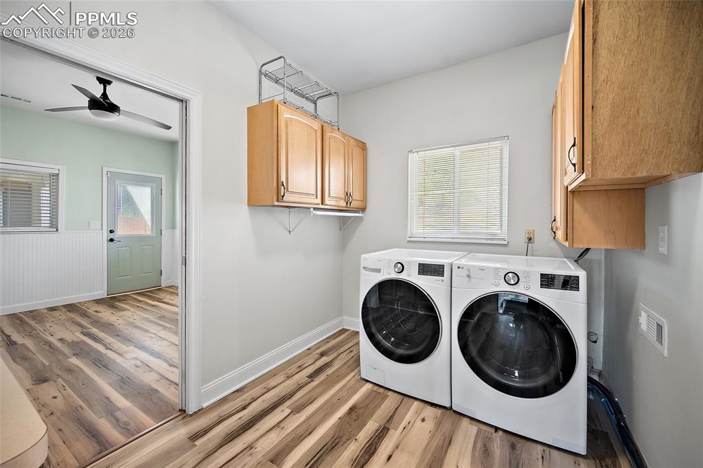 Image 21 of 50: Laundry room and bonus room.