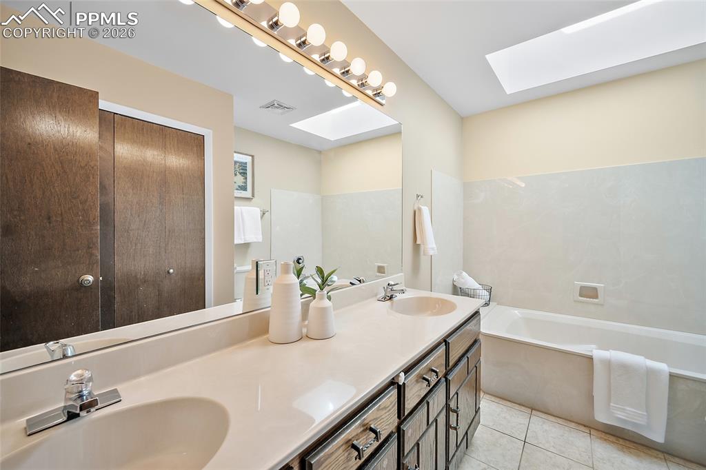 Image 23 of 50: Main level hall bathroom.