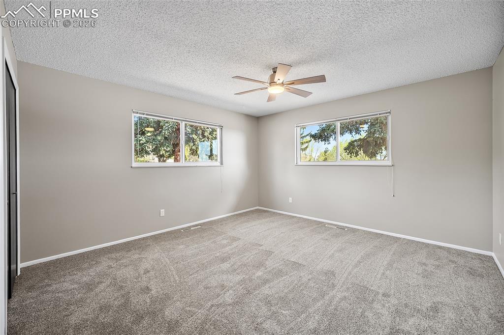 Image 25 of 50: 2nd main level bedroom.