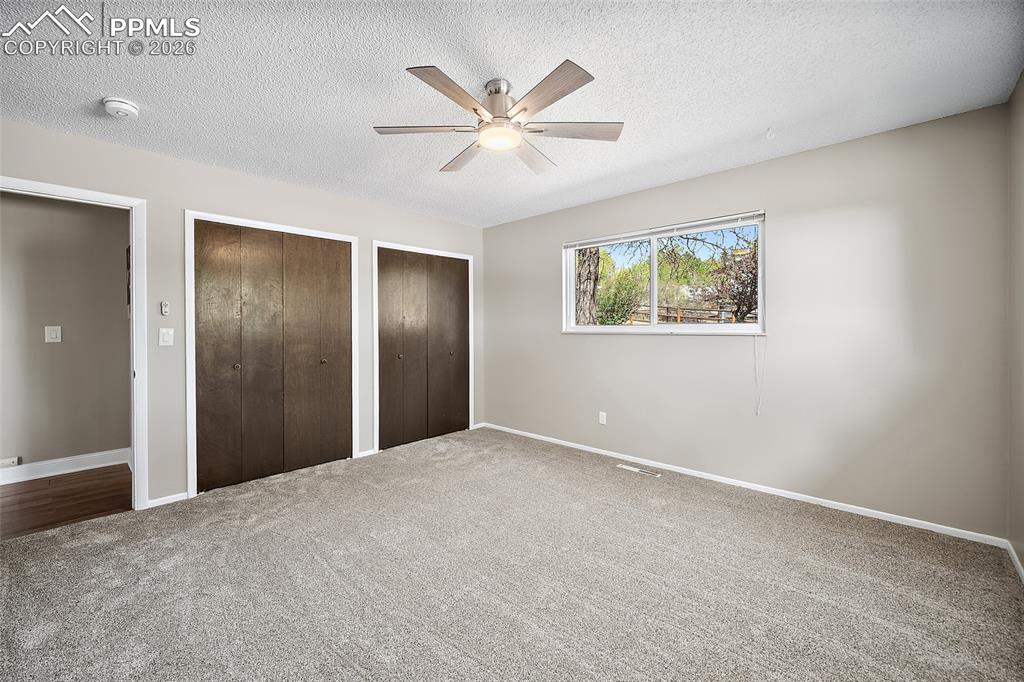 Image 26 of 50: 2nd main level bedroom.
