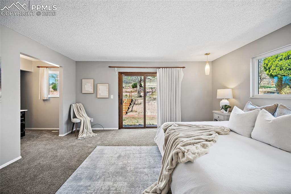 Image 27 of 50: Main level primary bedroom.