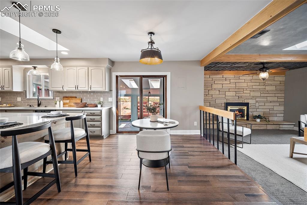 Image 8 of 50: Living room open to the kitchen.