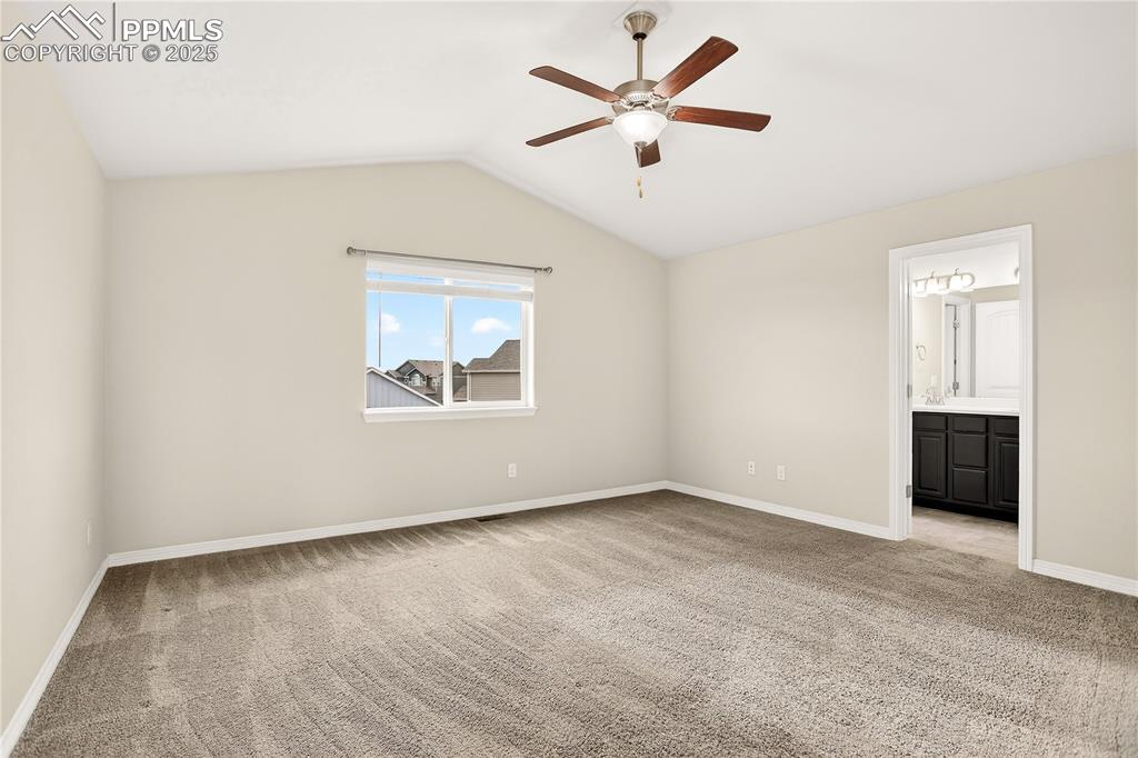 Image 11 of 24: Primary suite - vaulted ceiling & en-suite bath