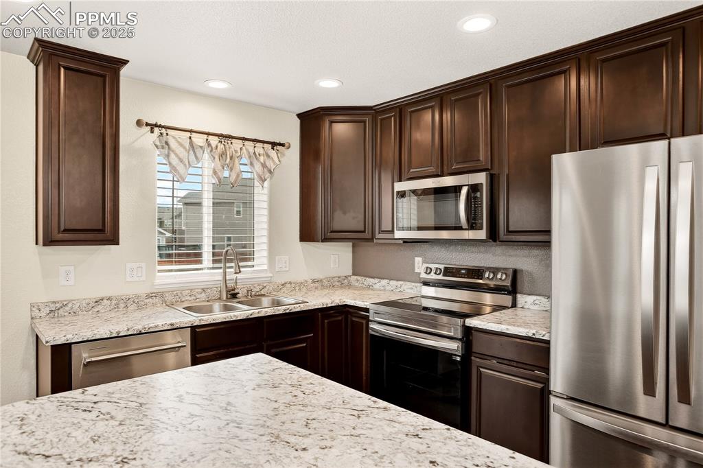 Image 6 of 24: SS appliances including new stove & dishwasher