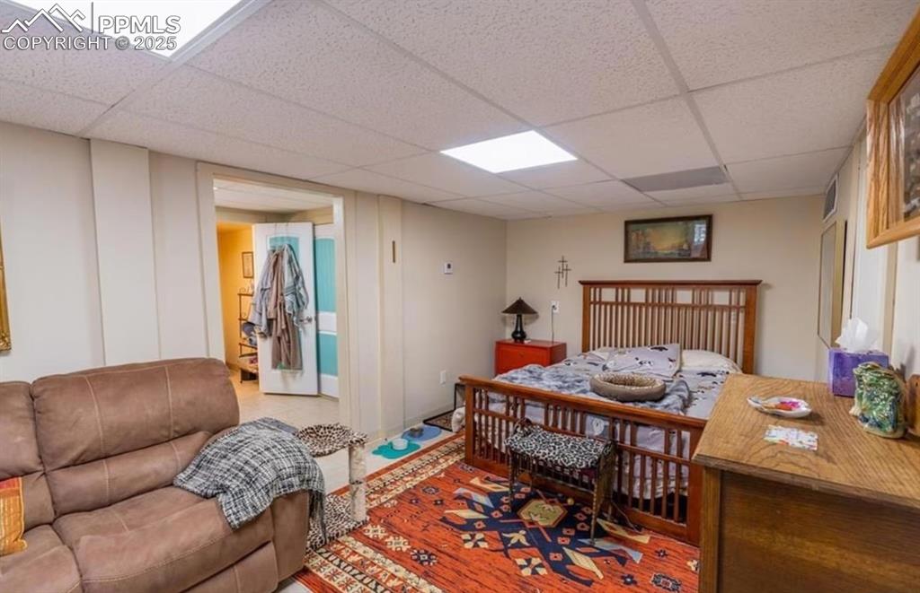 Image 9 of 23: Bedroom featuring a paneled ceiling