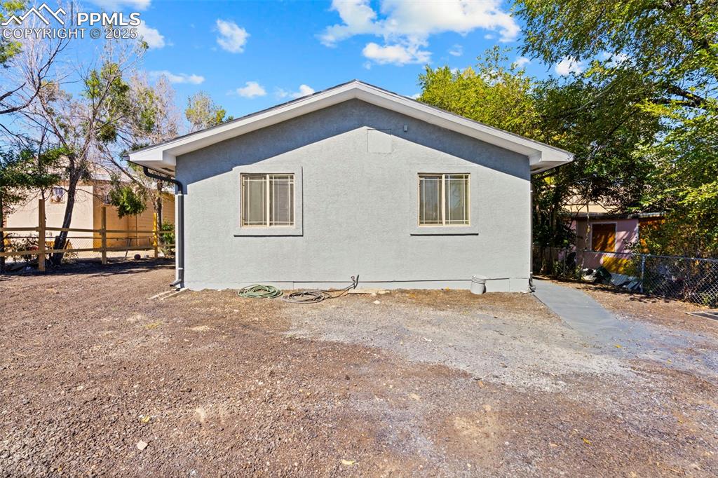 Image 29 of 32: View of property exterior with stucco siding