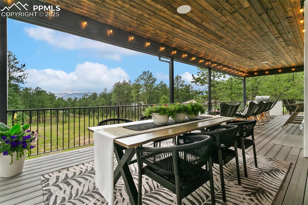 Image 12 of 50: Dining "Al Fresco" under the covered deck with gorgeous Views.