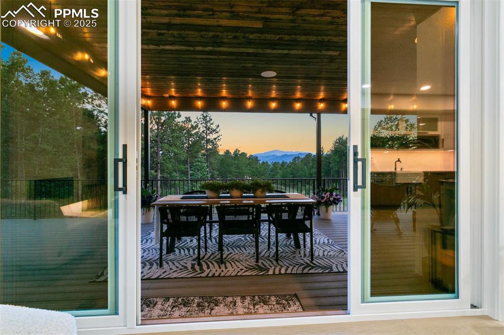 Image 16 of 50: Walk out of the great Room and Entertain with the best views in the area!