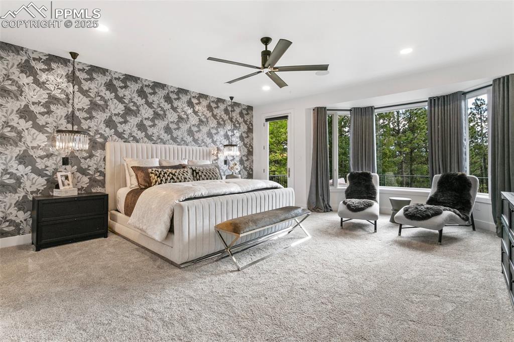 Image 19 of 50: Enjoy gorgeous views of Pikes Peak, a private sitting area, and walk-out ac