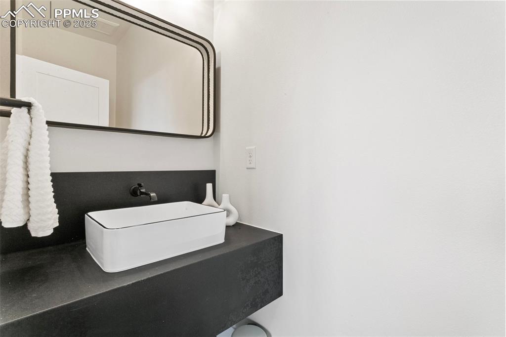 Image 27 of 50: Upper level Powder Room