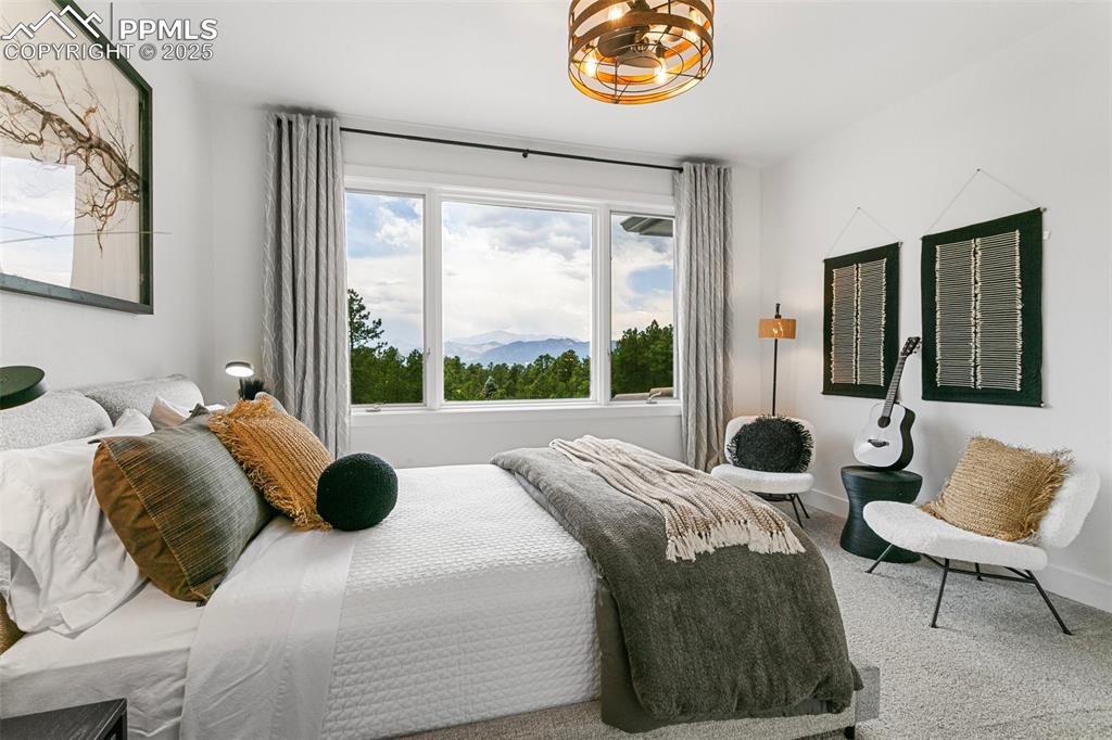 Image 30 of 50: Large windows capture the amazing views from the bedroom!