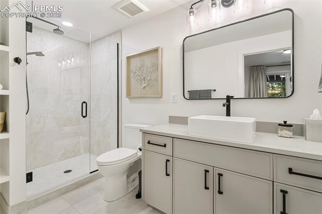 Image 43 of 50: Custom shower with 2 heads and large vanity