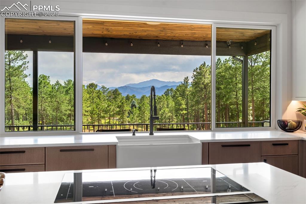 Image 7 of 50: Enjoy amazing Pikes Peak Views from the Kitchen pass thru window! A Family