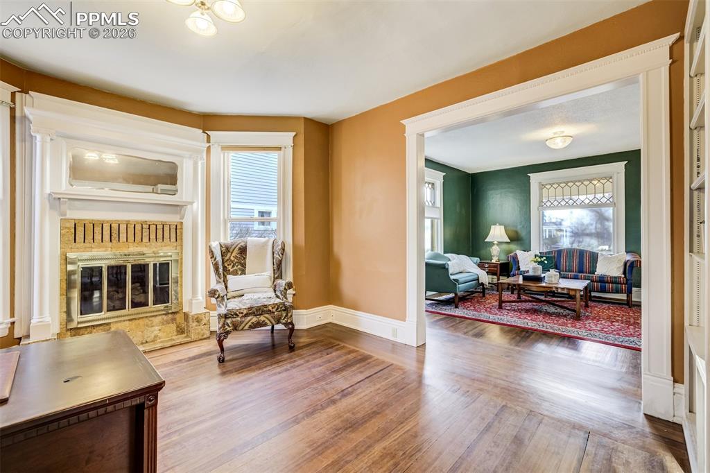 Image 10 of 50: Family room flows to the Living Rooms