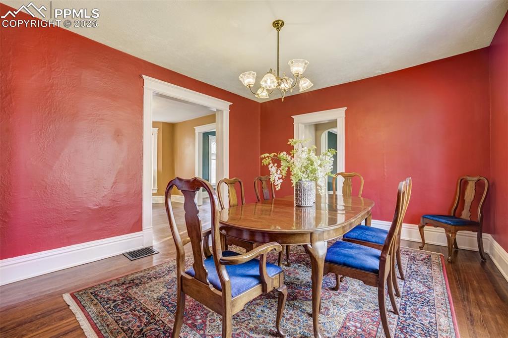 Image 14 of 50: Formal Dining Room is spacious and lovely
