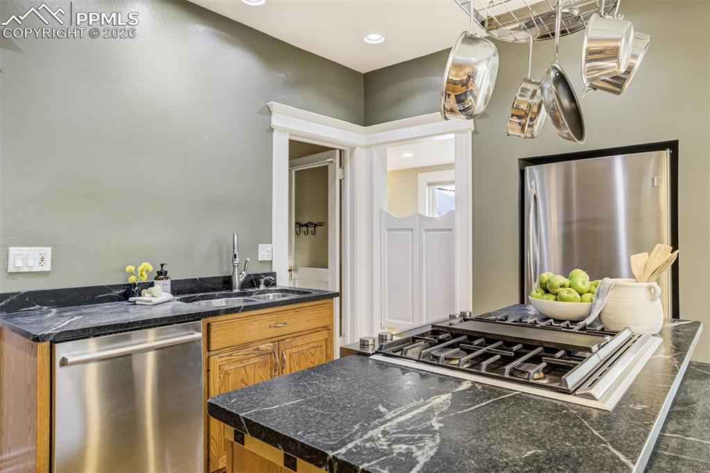 Image 20 of 50: Updated with Stunning soapstone counters throughout kitchen