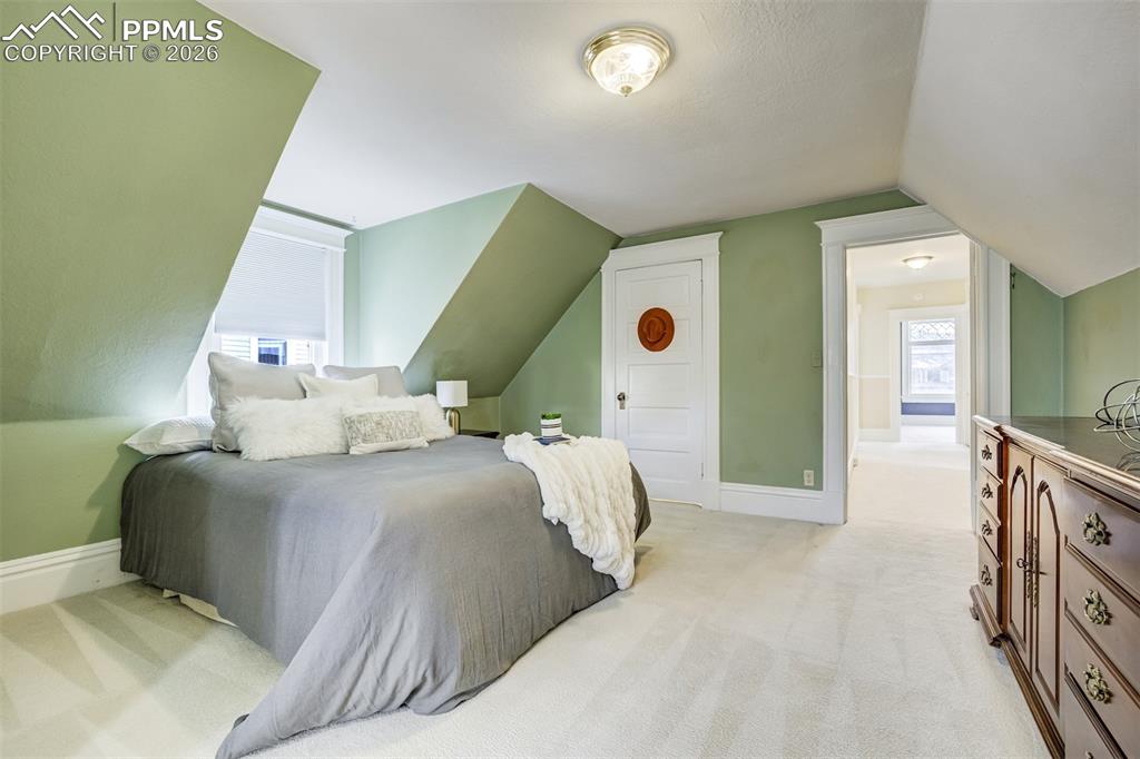 Image 25 of 50: A Charming retreat offers a walk-in closet as well! 