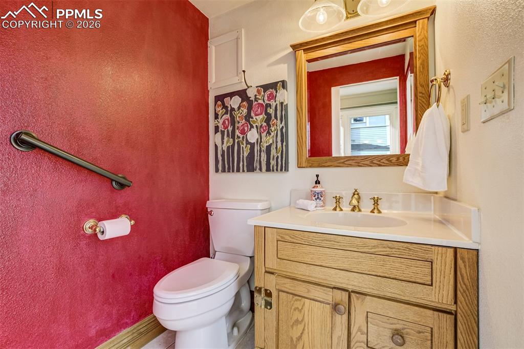 Image 39 of 50: Main level half bathroom