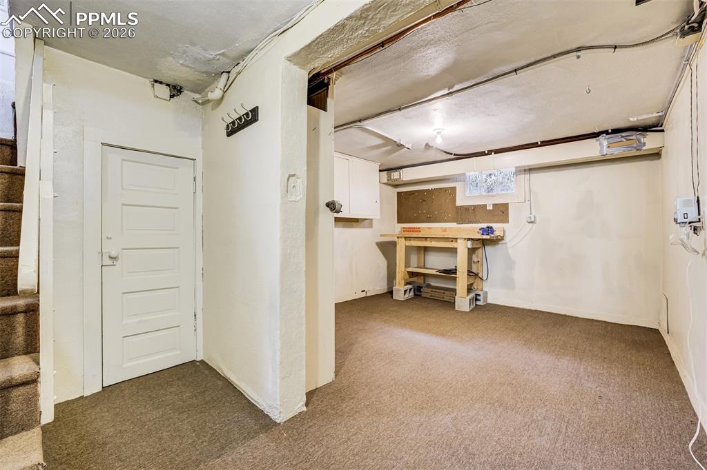 Image 40 of 50: Basement offers abundant storage and great space for workshop and hobbies!