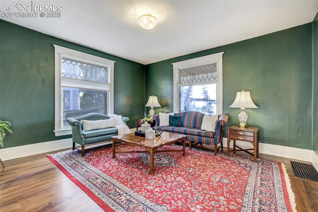 Image 6 of 50: Beautiful detail in the living room - look at the large picture windows!