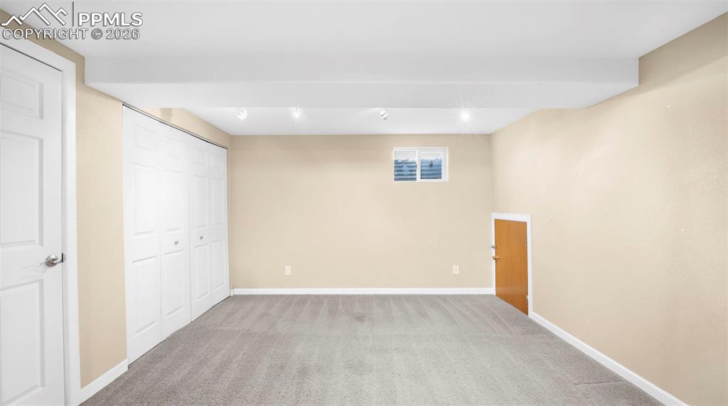 Image 24 of 32: Unfurnished bedroom with light colored carpet and a closet
