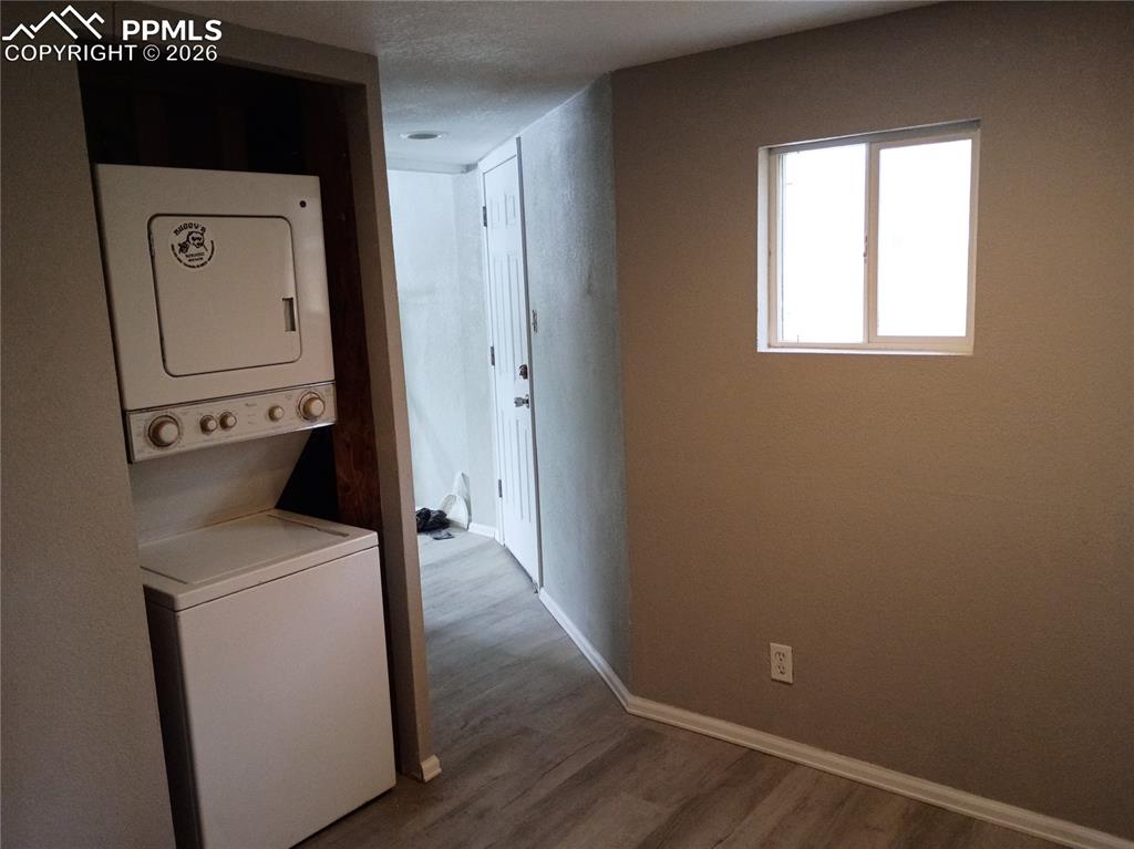 Image 8 of 10: Washer/Dryer combo stays with home.