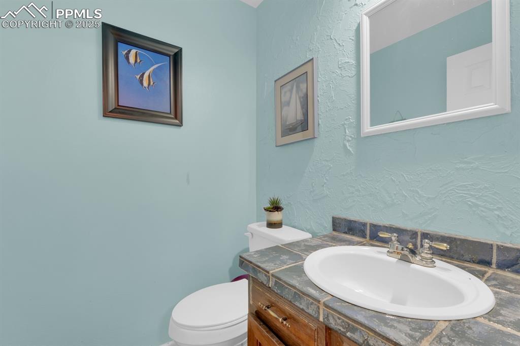 Image 13 of 32: Hall half bathroom on main level