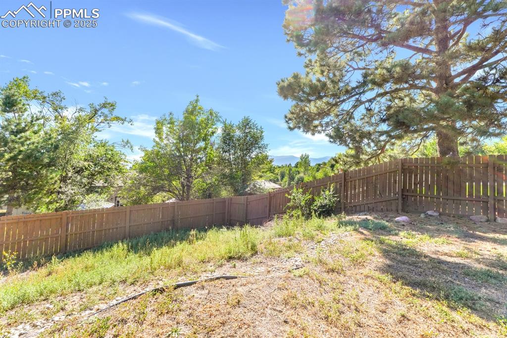 Image 27 of 32: View of fenced backyard
