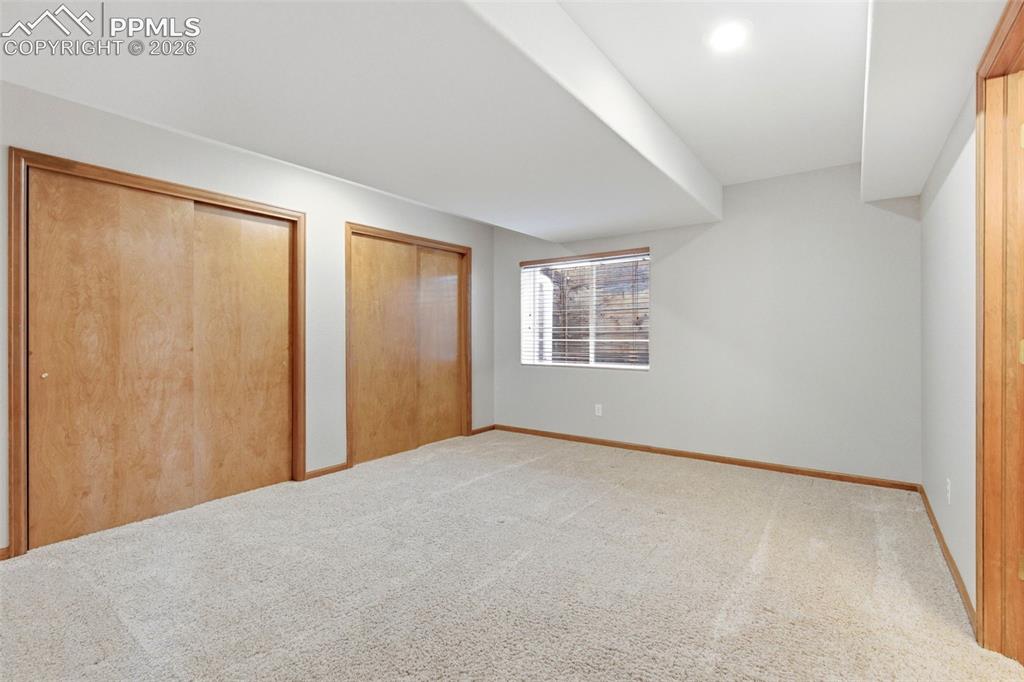 Image 26 of 40: Neutral-toned carpeting throughout