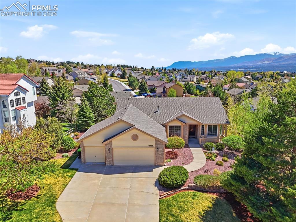 Image 37 of 40: Ranch-style residence featuring a concrete driveway, two-car garage, and a