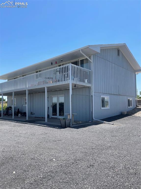 Image 4 of 4: Back of house featuring a patio area