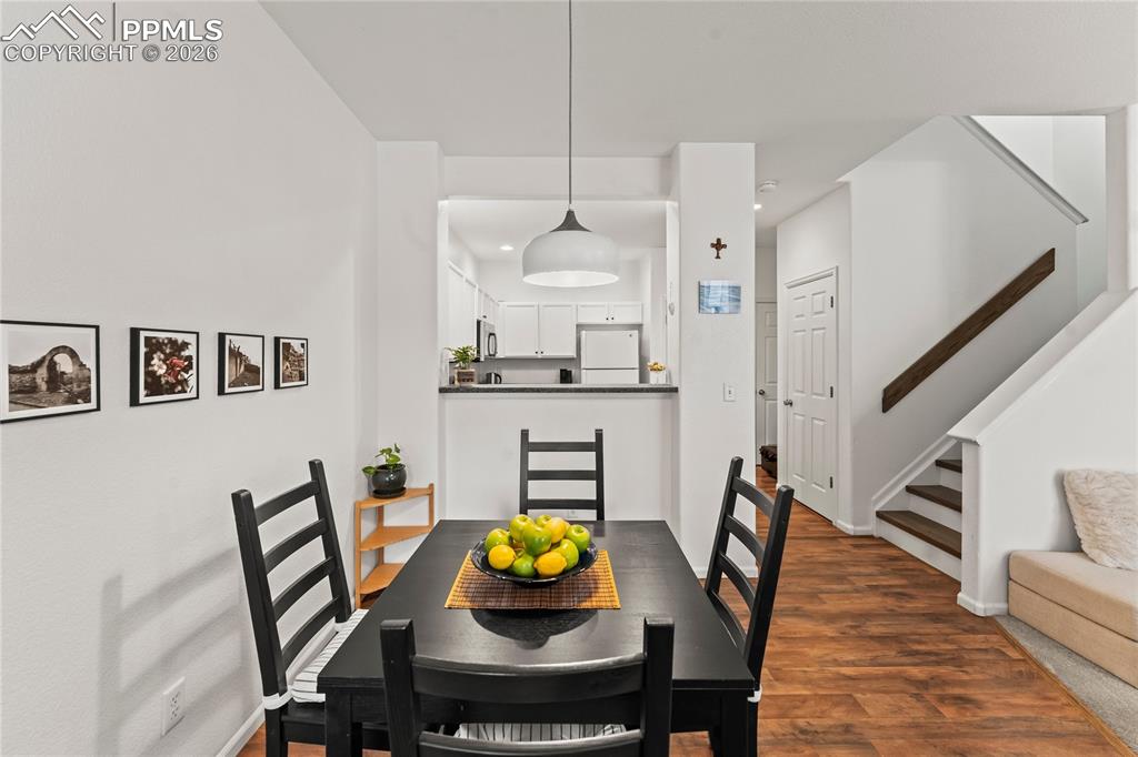 Image 11 of 41: Dining Area looking into the kitchen