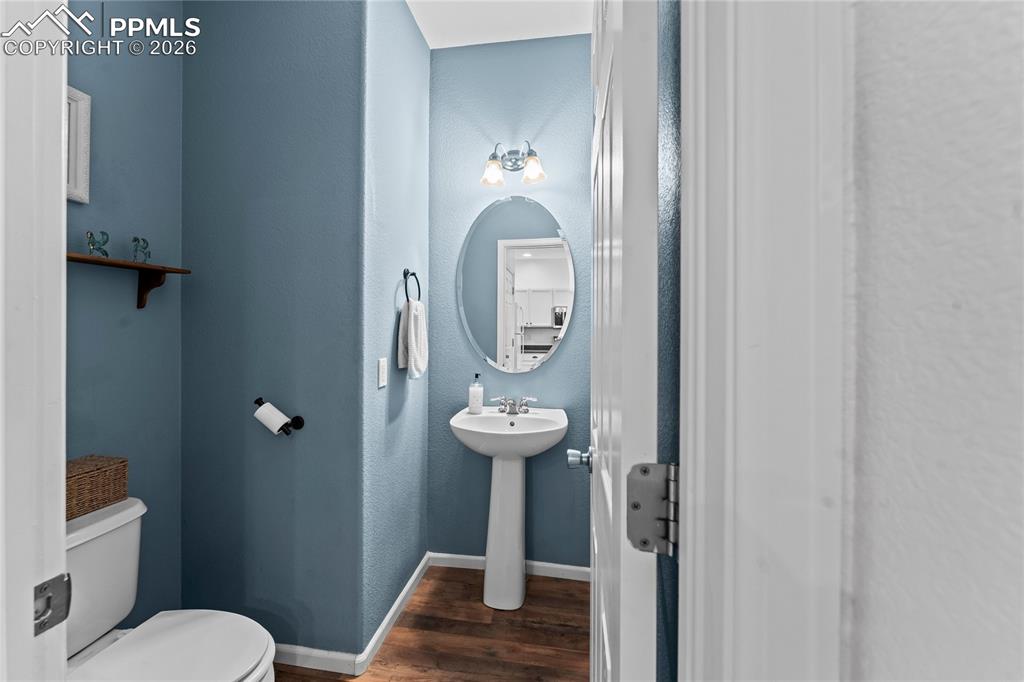 Image 16 of 41: Half bathroom off of kitchen