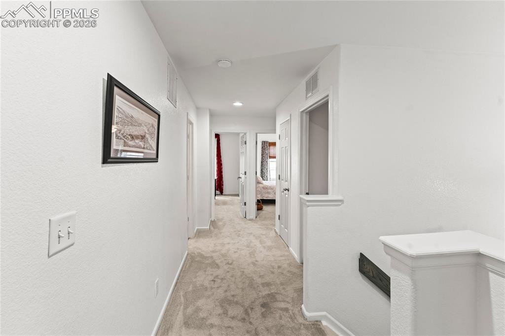 Image 20 of 41: Upstairs Hallway from Primary Bedroom