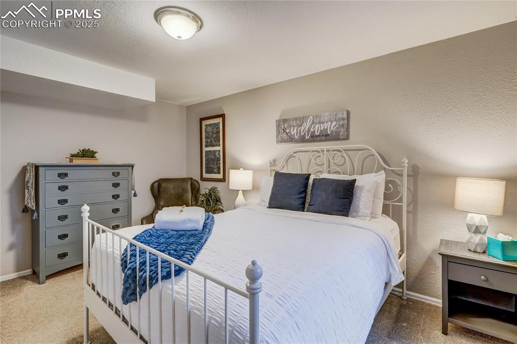 Image 29 of 35: 4th bedroom located in the basement with good light coming in from the outs