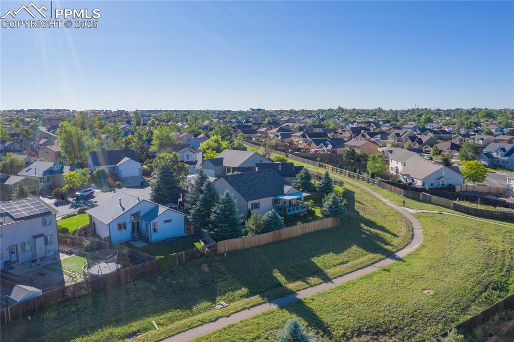 Image 32 of 35: View of property location shows the trails and open area located behind the
