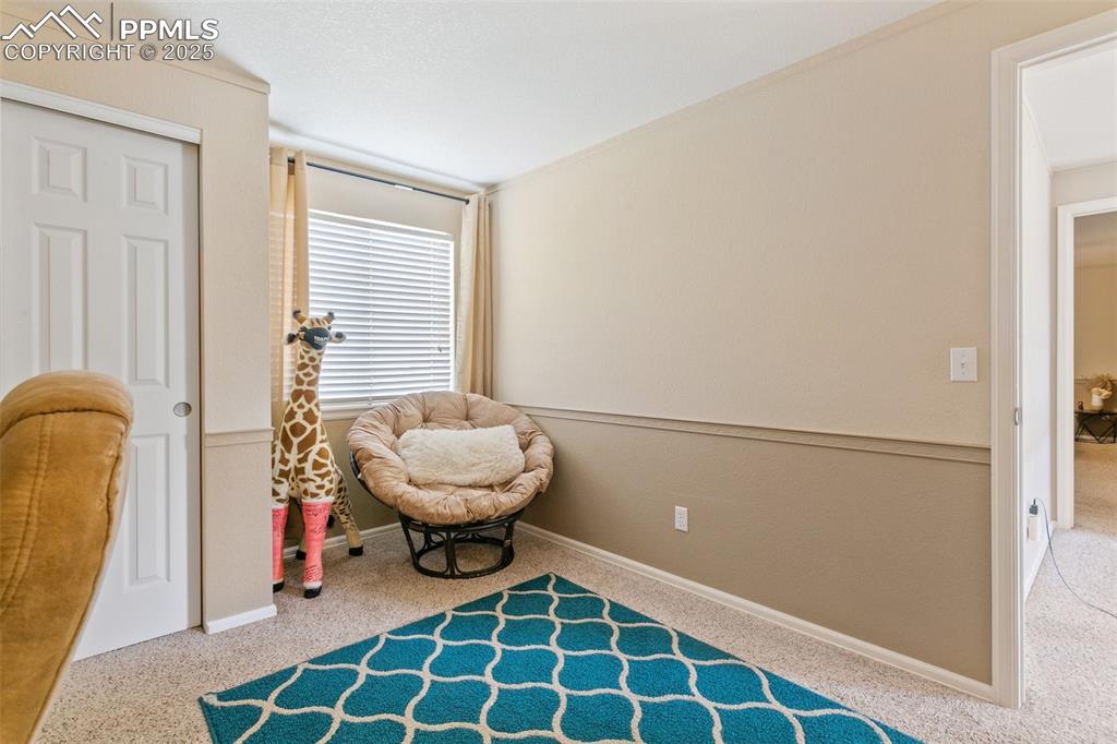 Image 34 of 46: Sitting room featuring carpet flooring and baseboards