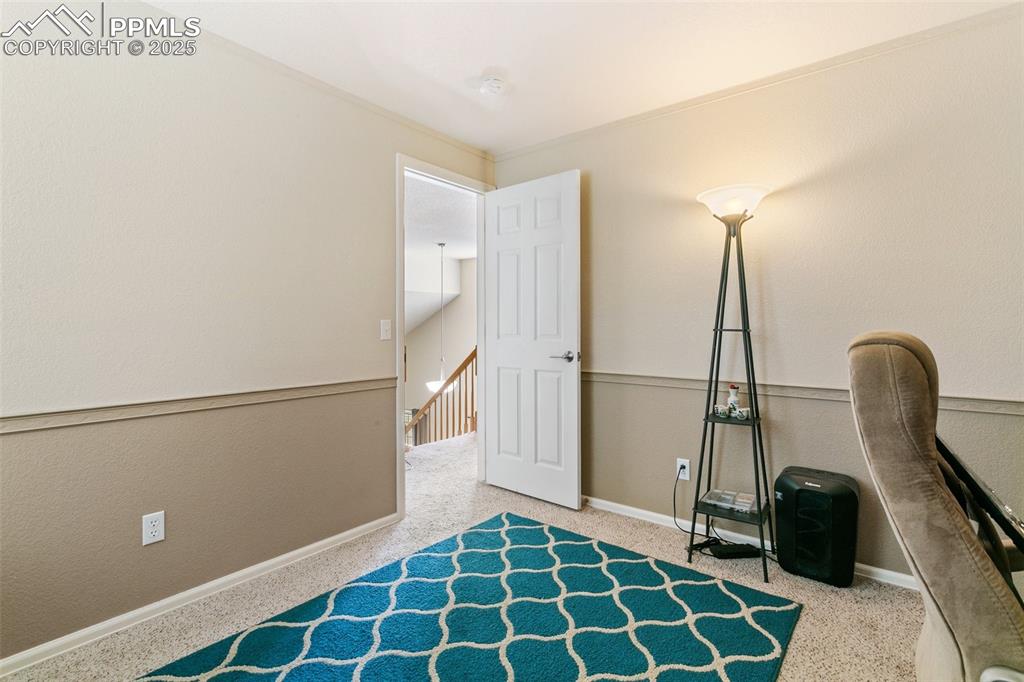 Image 35 of 46: Sitting room featuring carpet and an upstairs landing