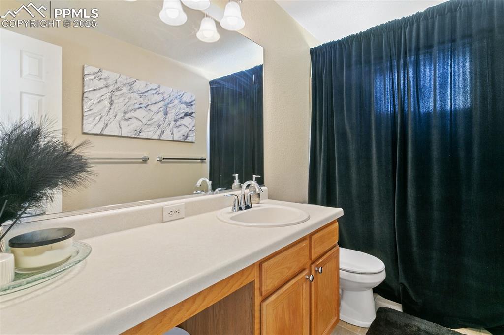 Image 36 of 46: Full bathroom with toilet and vanity