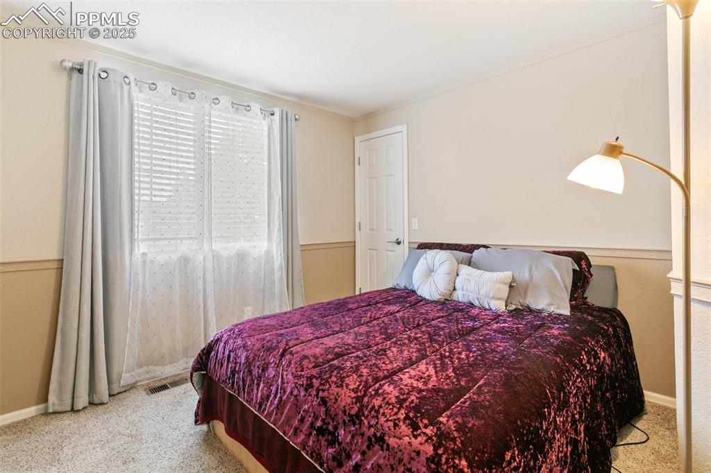 Image 40 of 46: Bedroom featuring carpet floors and baseboards